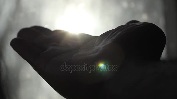 Abstract. Hand Playing with the sun. Selective focus. — Stock Video