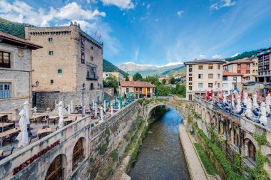 POTES, SPAIN - MAY 10, 2019: Potes is one of the most interesting tourist spots of the Comarca of Liebana near Santander, Cantabria province, Spain. clipart