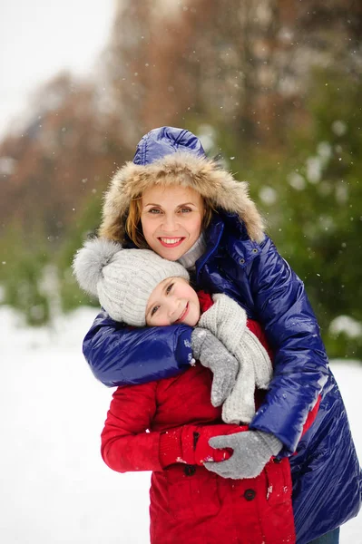 Mother tenderly embraces the daughter. Royalty Free Stock Images