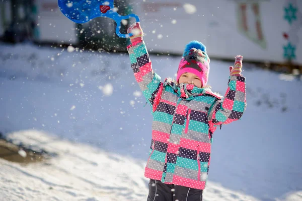 Girl of younger school age on walk in winter day. — Stock Photo, Image