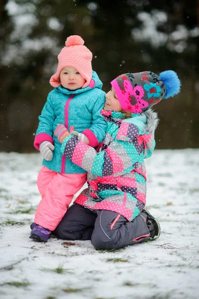 Two little sisters on winter walk. — Stock Photo, Image