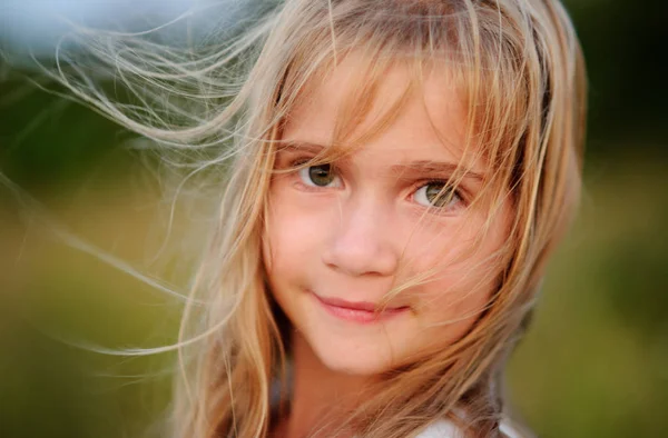 Portrait of the charming girl of 9-10 years.
