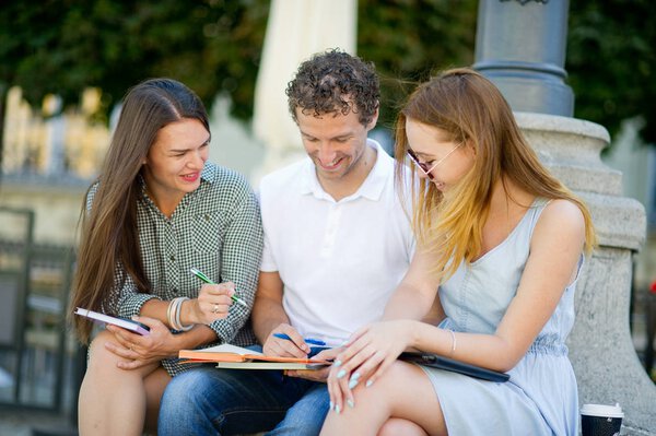 Three students are preparing for exams.