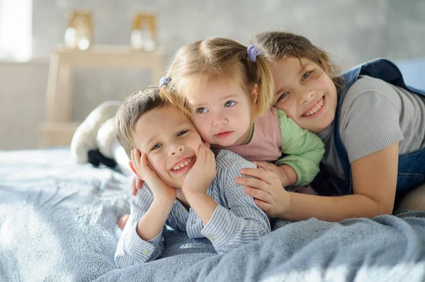 Two sisters and a brother. — Stock Image Two sisters and a brother. Royalty Free Stock Images