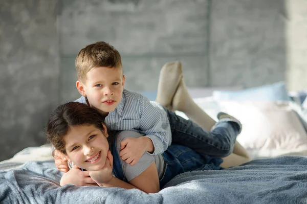 Two Children Boy Girl Lie Bed Younger Brother Embraces Elder — Stock Photo, Image