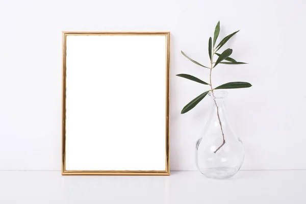 Golden frame mock-up on white wall — Stock Photo, Image