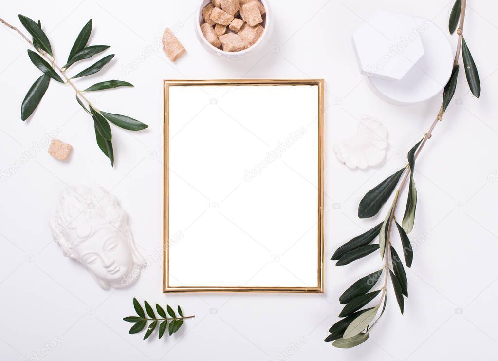 Golden frame mock-up on white tabletop