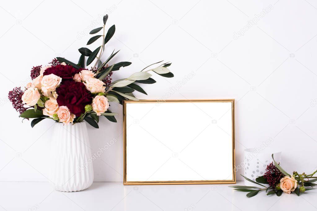 Golden frame mock-up on white wall