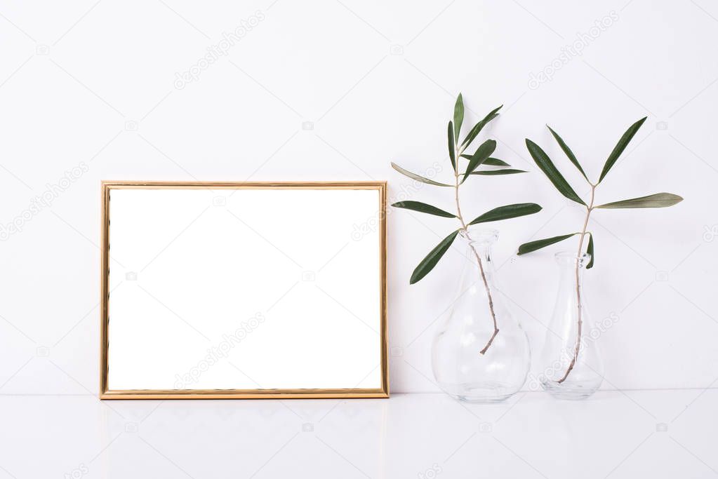 Golden frame mock-up on white wall