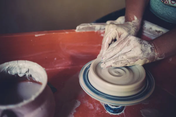 Work in a pottery workshop, womans hands creating ceramics. — Stock Photo, Image