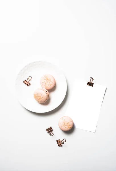 Social media flat lay with orange macaroons and postcard mock up — Stock Photo, Image