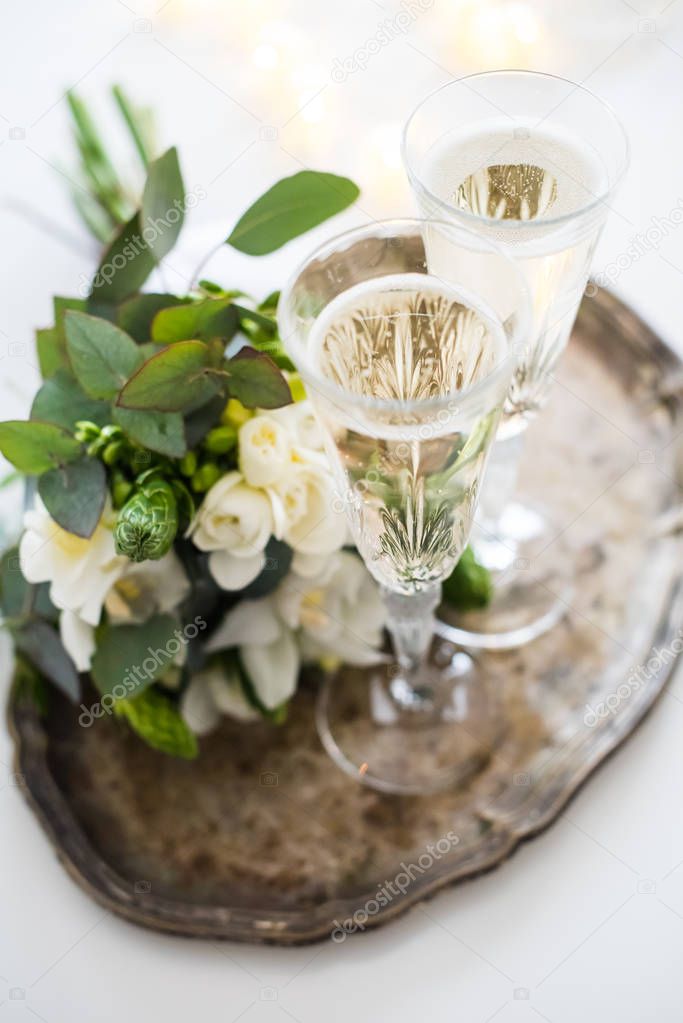 Beautiful vintage wedding decoration with champagne and white fl