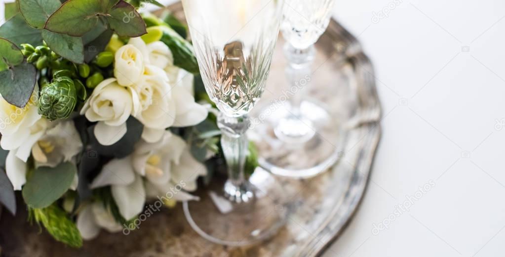 Beautiful vintage wedding decoration with champagne and white fl