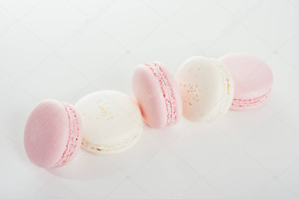Exquisite french dessert, pink and cream macaron cakes 