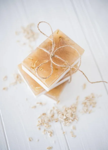 White and beige handmade soap bars with oat flakes — Stock Photo, Image