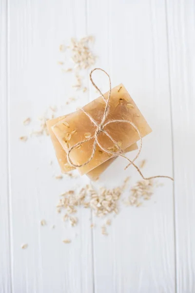 White and beige handmade soap bars with oat flakes — Stock Photo, Image