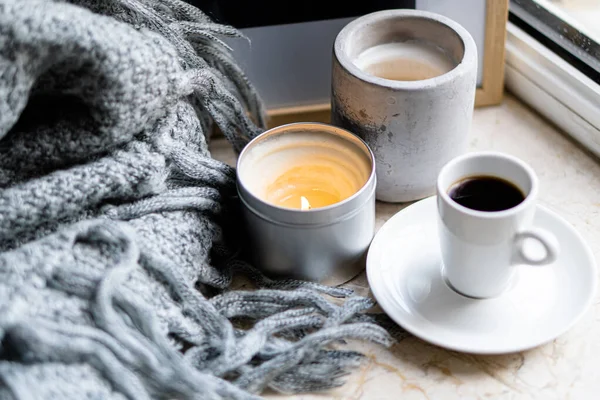 Burning candles, gray blanket and cup of coffee — ストック写真