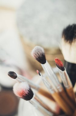 Many different makeup brushes in artists studio