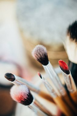 Many different makeup brushes in artists studio