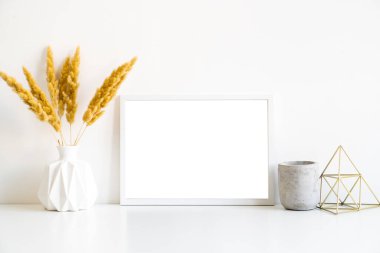 White frame and home decoration details on tabletop with wall, artwork poster mock-up