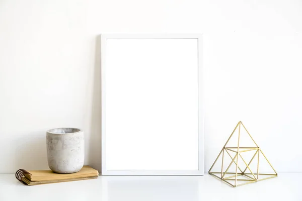 White frame and home decoration details on tabletop with wall, artwork poster mock-up — Stockfoto