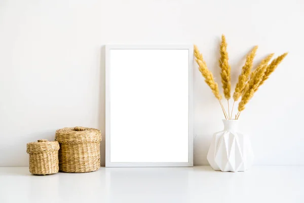 White frame and home decoration details on tabletop with wall, artwork poster mock-up — 스톡 사진