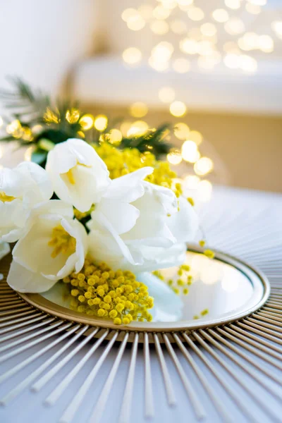 Bouquet of white tulips and mimosa flowers on mirror tray — Stock Photo, Image