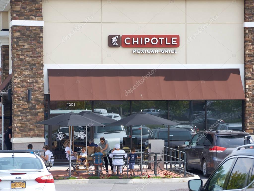 PLATTSBURGH, USA - AUGUST 23, 2017 : Chipotle restaurant and logo. Chipotle Mexican Grill, Inc is an American chain of fast casual restaurants in the United States