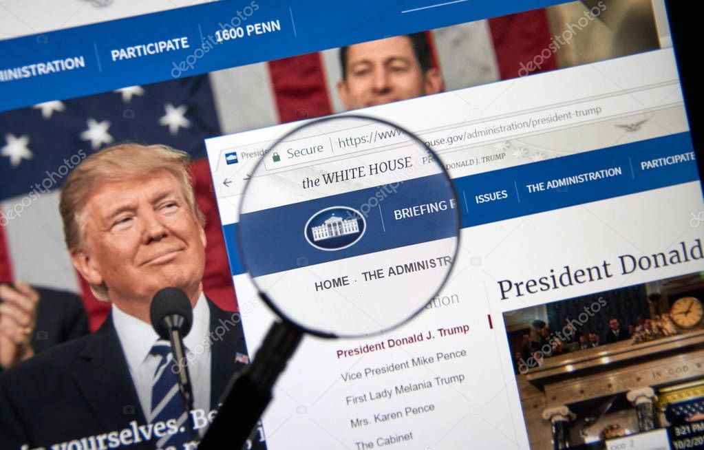 MONTREAL, CANADA - OCTOBER 2, 2017: Trump Administration web site under magnifying glass. Donald J. Trump is the 45th President of the United States.