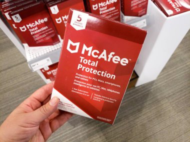 A hand holding McAfee Total Protection clipart
