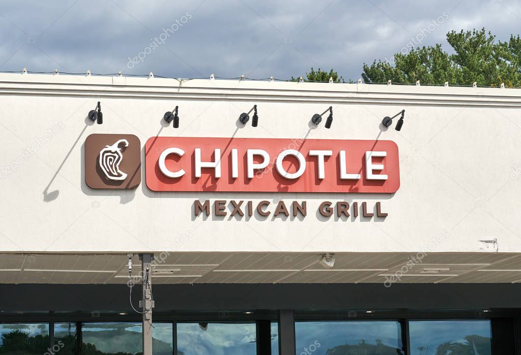 Montreal, Canada - September 7, 2019: Chipotle restaurant and logo on a sunny day. Chipotle, is an American chain of fast casual restaurants specializing in tacos and Mission-style burritos