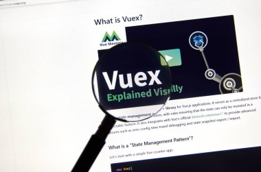 Montreal, Kanada - 08 Mart 2020: Vuex logosu büyüteç altında. Vue.js, kullanıcı arayüzleri ve tek sayfalık uygulamalar için açık kaynaklı bir Model Görünüm Modeli JavaScript çerçevesidir.