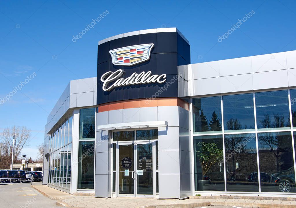 Montreal, Canada - April 4, 2020: Cadillac dealership logo and writing. Cadillac is a division of American automobile manufacturer General Motors GM that designs and builds luxury vehicles.