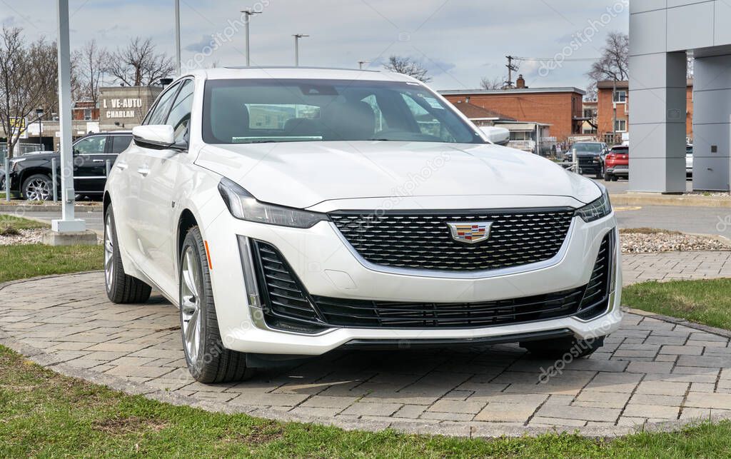 Montreal, Canada - May 2, 2020: New Cadillac 2020 CT5 350T white car. Cadillac is a division of the American automobile manufacturer General Motors GM that designs and builds luxury vehicles