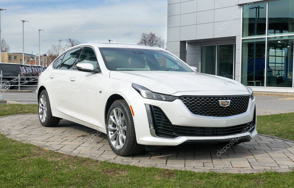 Montreal, Canada - May 2, 2020: New Cadillac 2020 CT5 350T white car. Cadillac is a division of the American automobile manufacturer General Motors GM that designs and builds luxury vehicles