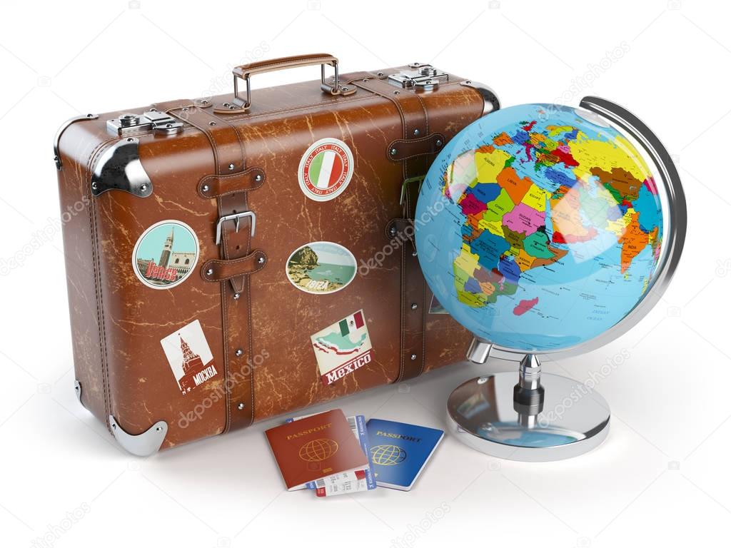 Travel or tourism concept. Old suitcase with stickers, globe and