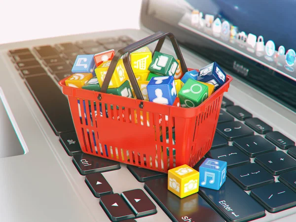 Laptop computer application software icons in the shopping baske — Stock Photo, Image