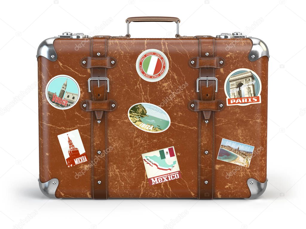 Old suitcase baggage with travel stickers isolated on white back