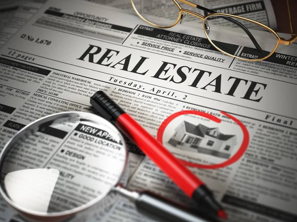 Real estate classifieds ads newspaper  and magnifying glass. — Stock Photo, Image