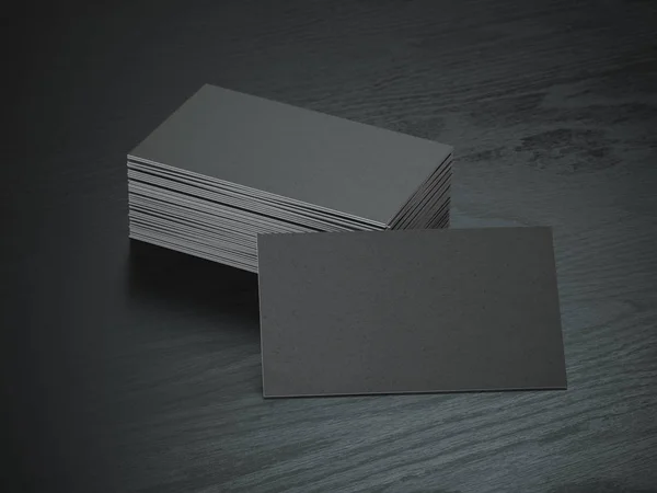 Tarjetas de visita negras en blanco maqueta sobre fondo de mesa de madera negra — Foto de Stock