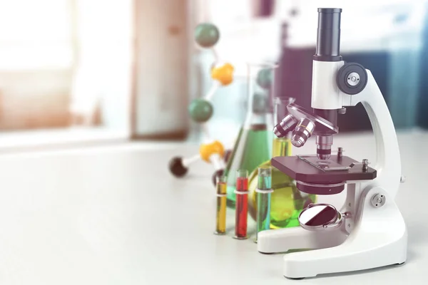 Microscope with lab glass, flasks and colbas.Science laborat — стоковое фото