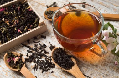 various types of tea on a wooden background