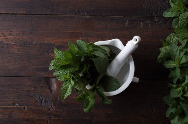 peppermint leaves in a mortar