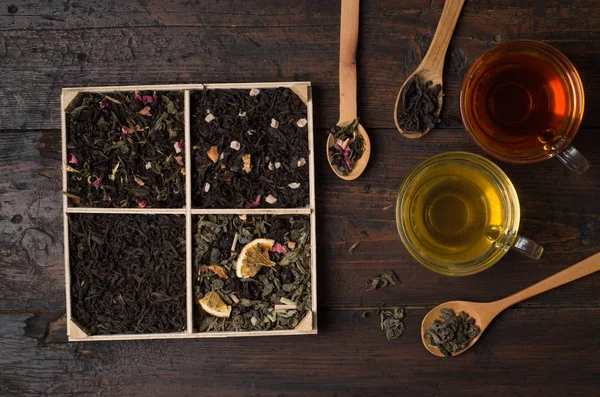 Various types of tea on a wooden background — 스톡 사진