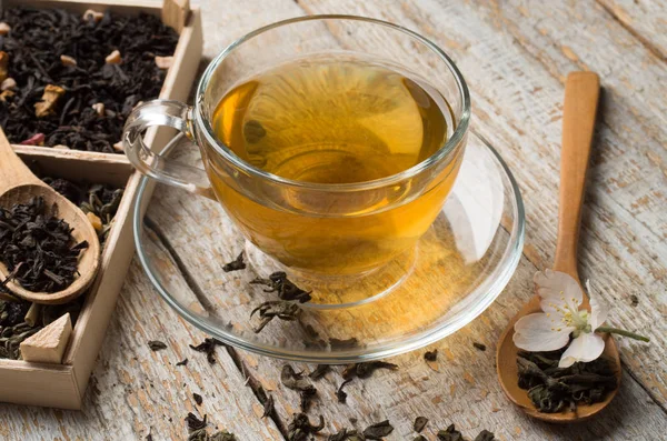 Various types of tea on a wooden background — Stok fotoğraf