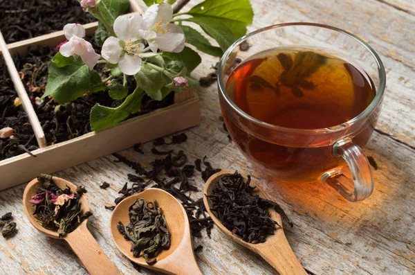 Various types of tea on a wooden background — Stok fotoğraf