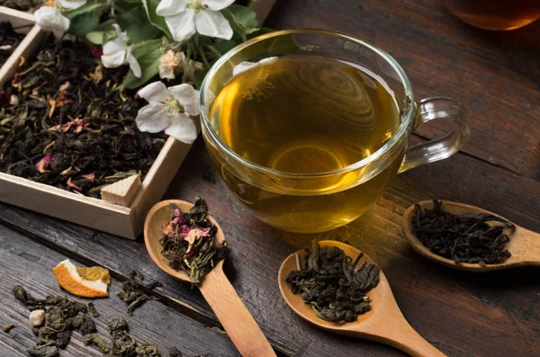 Various types of tea on a wooden background — Stok fotoğraf