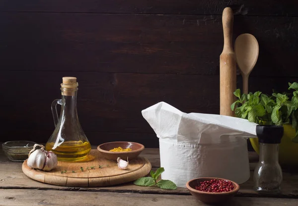 Chef's hat on an old wooden table. — 스톡 사진