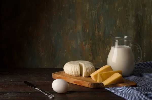 Dairy products on kitchen table — Stock Photo, Image