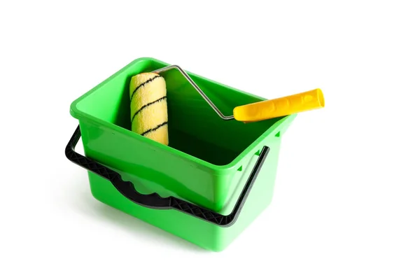 Paint roller in a green bucket. — Stock Photo, Image